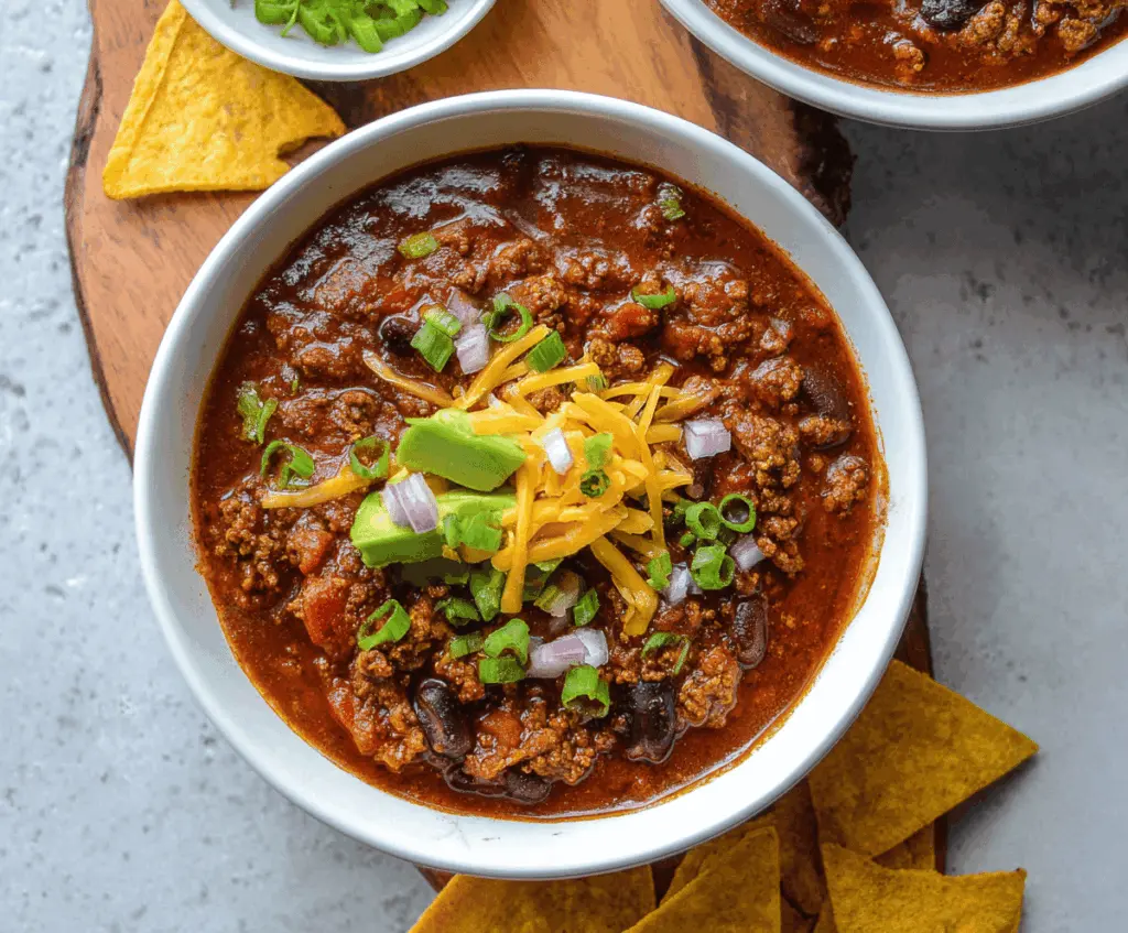 Hearty bowl of homemade bison chili with beans, tomatoes, and spices in a rustic bowl, perfect for a comforting meal.